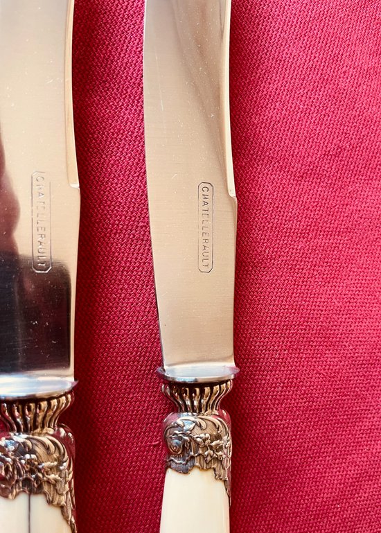 24 table knives with ivory handles and desserts.