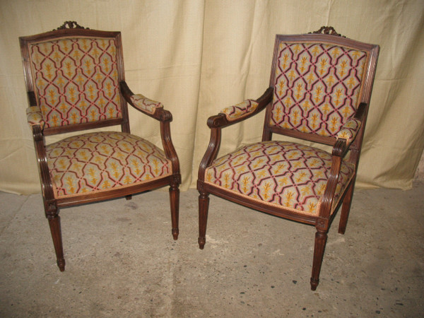 Pair of walnut armchairs with flat backs, 19th century Louis XVI style, stitched trim