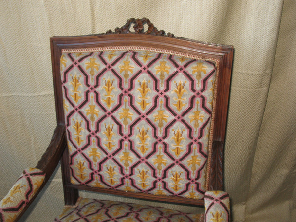 Pair of walnut armchairs with flat backs, 19th century Louis XVI style, stitched trim