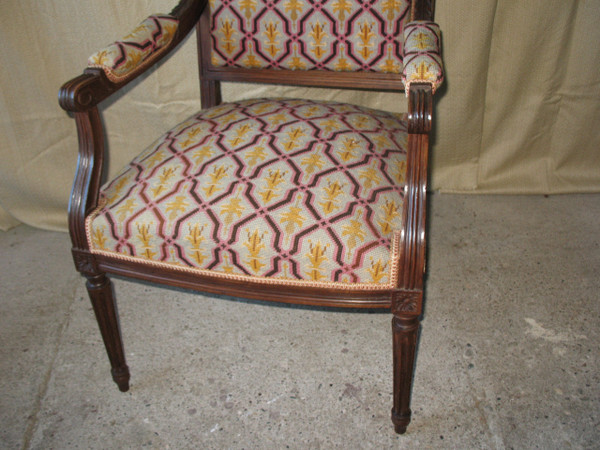 Pair of walnut armchairs with flat backs, 19th century Louis XVI style, stitched trim