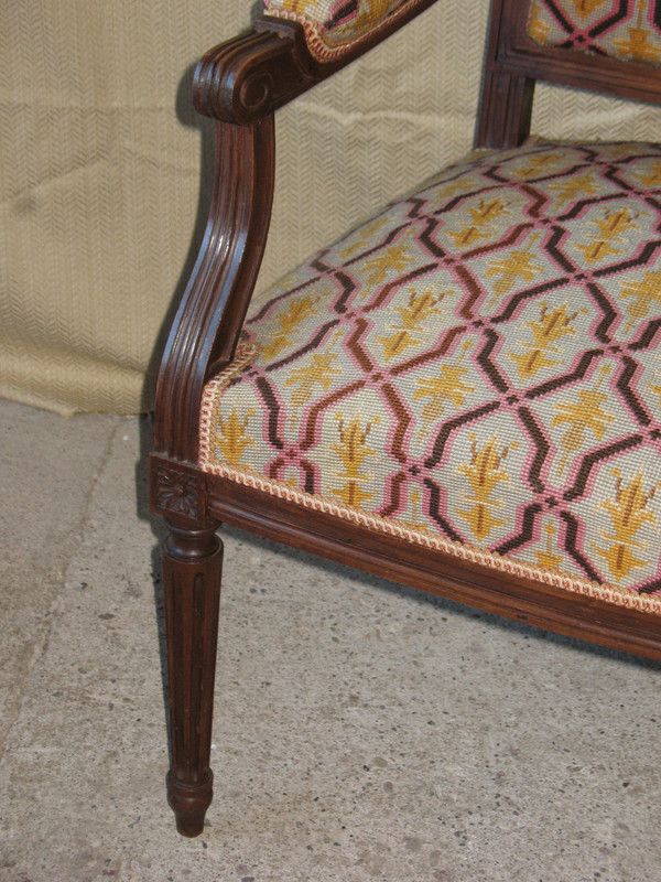Pair of walnut armchairs with flat backs, 19th century Louis XVI style, stitched trim