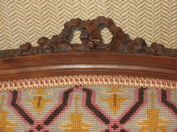 Pair of walnut armchairs with flat backs, 19th century Louis XVI style, stitched trim
