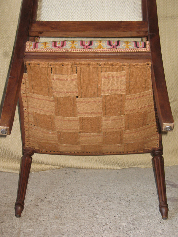 Pair of walnut armchairs with flat backs, 19th century Louis XVI style, stitched trim