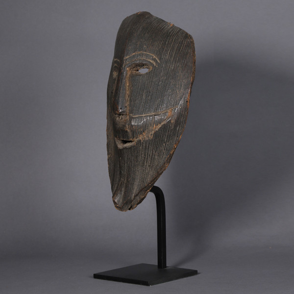 Smiling figure carved from a palm stem – Himalayas