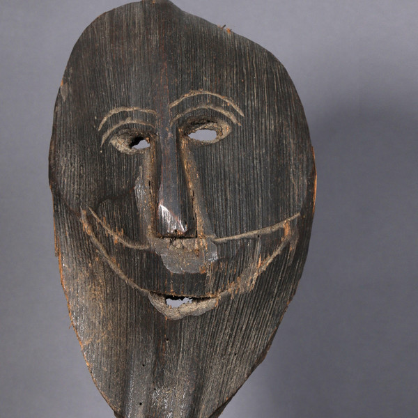 Smiling figure carved from a palm stem – Himalayas