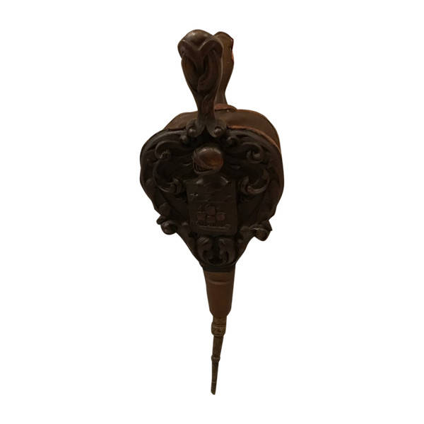 Old fireplace bellows in carved wood from the 19th century