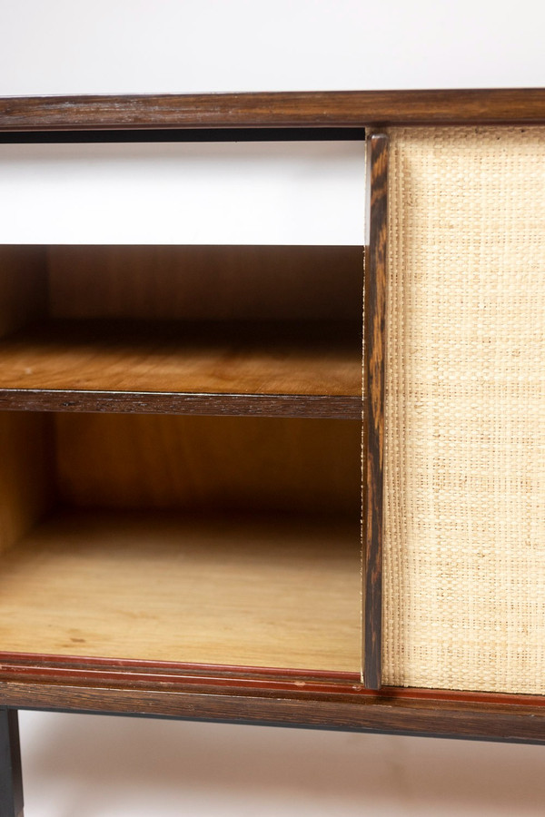 Sideboard in wenge, raffia and lacquered metal. 1970s.