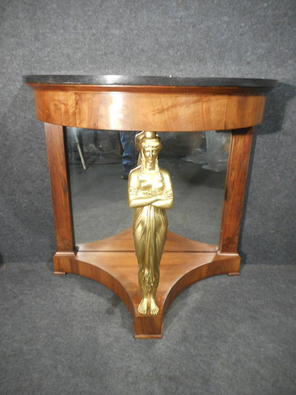 Coppia di console in mogano primo impero e cariatidi in bronzo dorato attribuite a Jacob