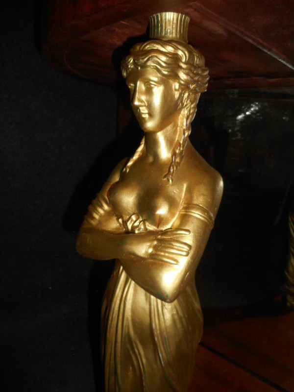 Coppia di console in mogano primo impero e cariatidi in bronzo dorato attribuite a Jacob