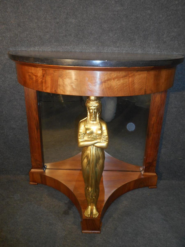 Coppia di console in mogano primo impero e cariatidi in bronzo dorato attribuite a Jacob