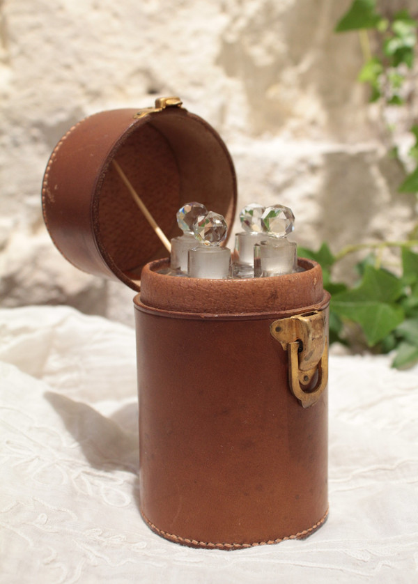 4 large bottles in leather case early 20th century
