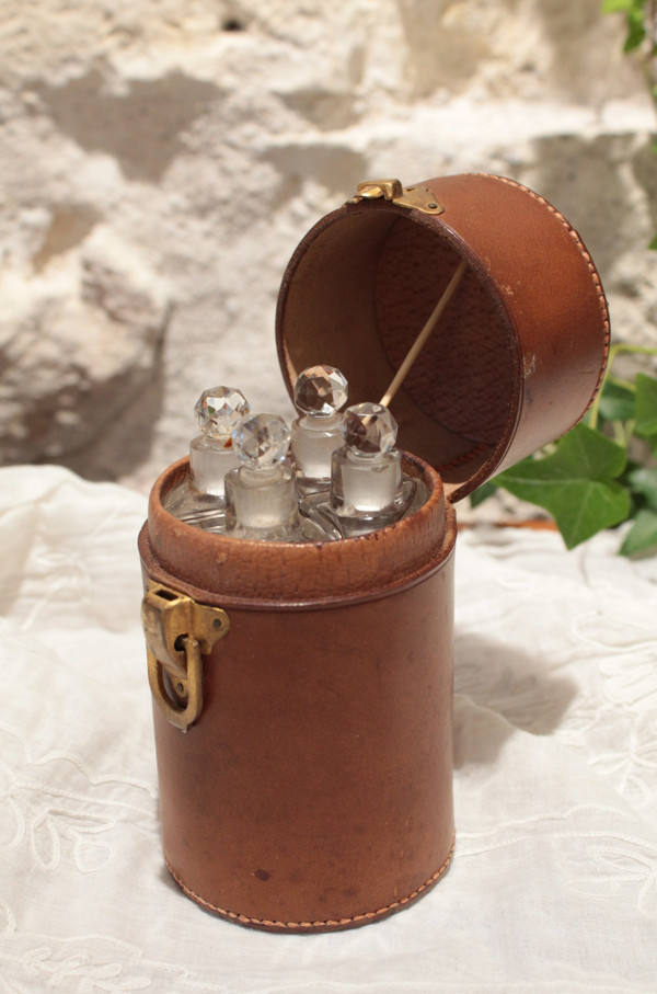 4 large bottles in leather case early 20th century