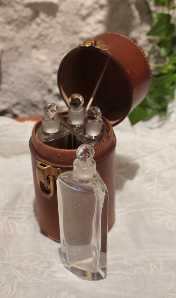 4 large bottles in leather case early 20th century