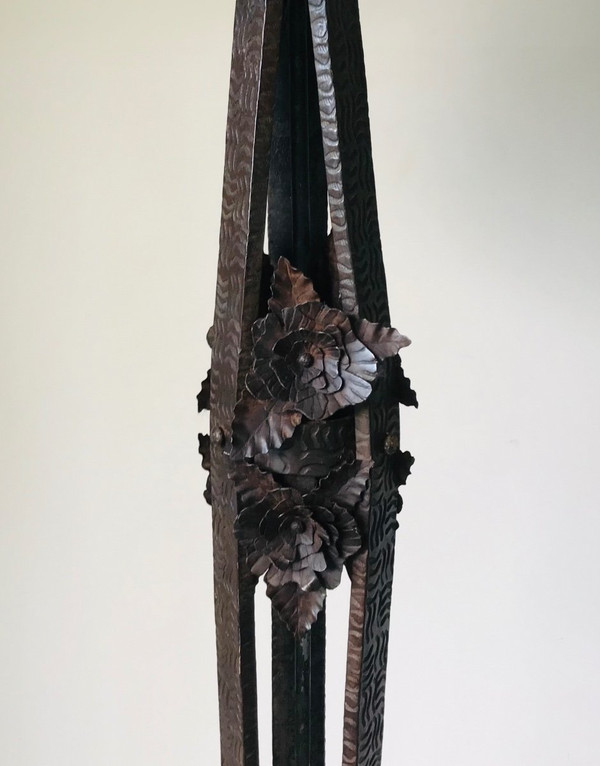 Art Deco wrought-iron floor lamp with flower design, circa 1930.