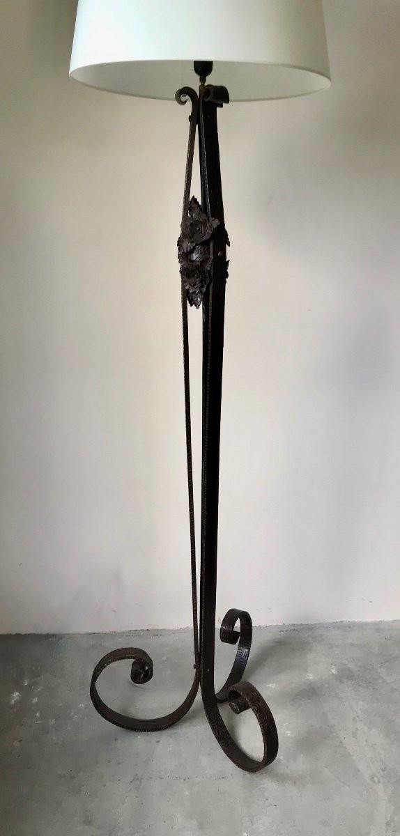 Art Deco wrought-iron floor lamp with flower design, circa 1930.