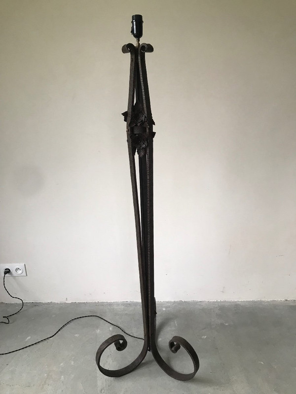 Art Deco wrought-iron floor lamp with flower design, circa 1930.