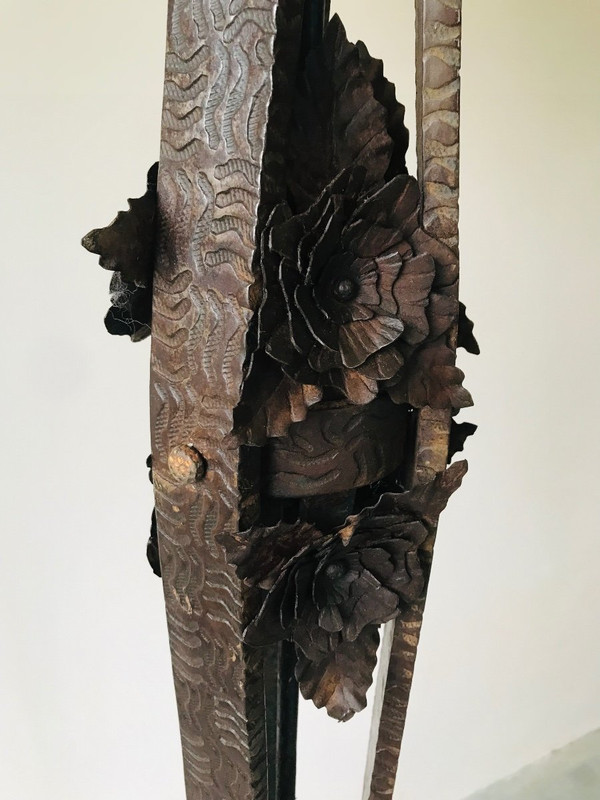 Art Deco wrought-iron floor lamp with flower design, circa 1930.