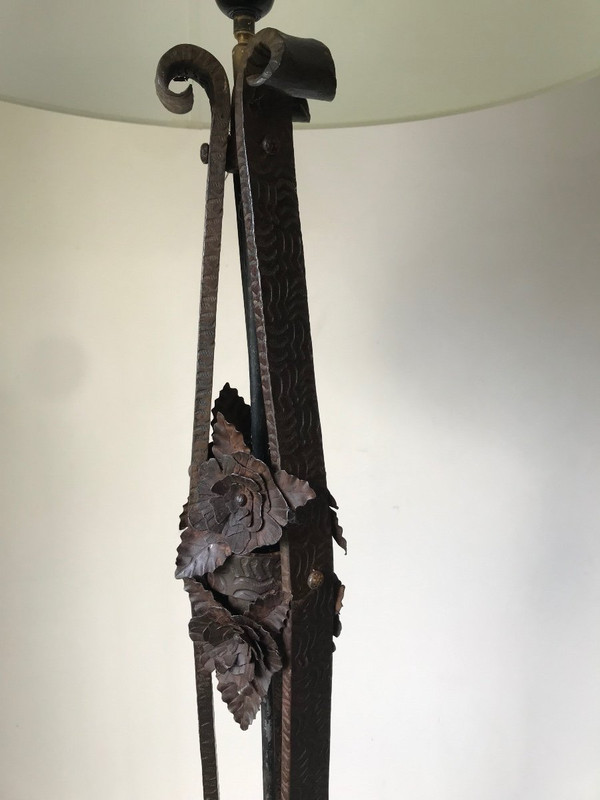 Art Deco wrought-iron floor lamp with flower design, circa 1930.