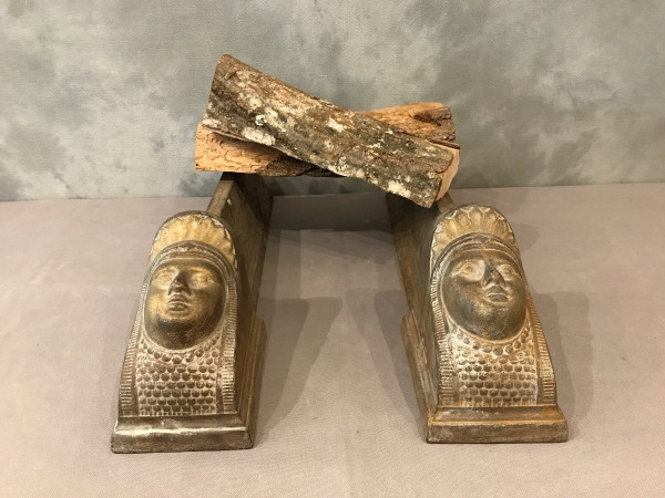 Pair of antique cast-iron andirons decorated with women's heads