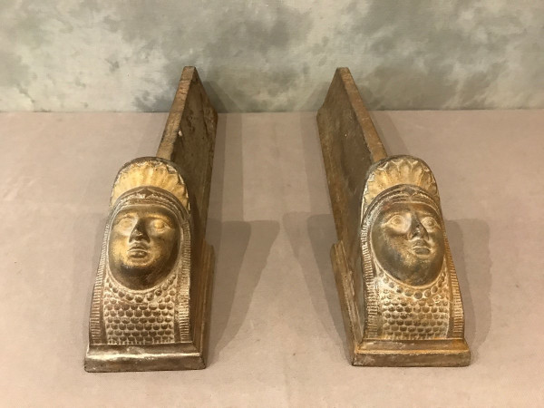 Pair of antique cast-iron andirons decorated with women's heads