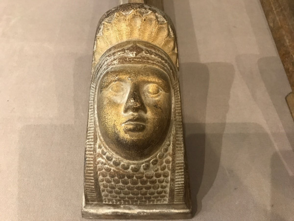 Pair of antique cast-iron andirons decorated with women's heads