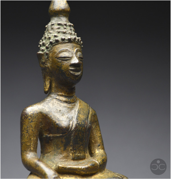 Laos, 18th century, Buddha in bumisparsha mudra position, Old lacquered and gilded bronze