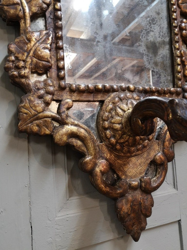Italian Mirror With Arms Of Light In Carved And Gilded Wood. 18th century period