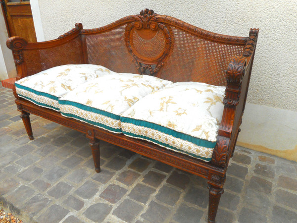 Divano intagliato in noce e canna, epoca Napoleone III