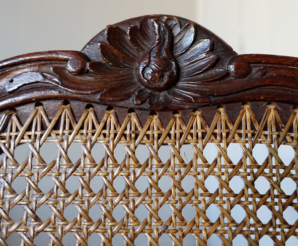 Fauteuil canné d'époque Régence Louis XV à coussin de soie