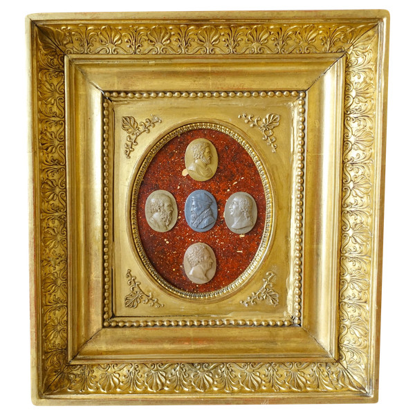 Antique cameos in an Empire frame, souvenir of the Grand Tour on a porphyry background