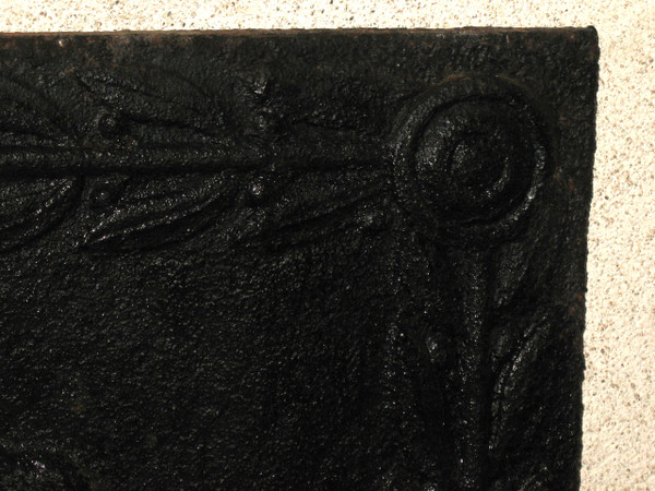 Large cast-iron fireback from the 18th century decorated with coat of arms and lyre
