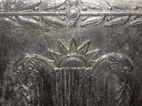 Large cast-iron fireback from the 18th century decorated with coat of arms and lyre