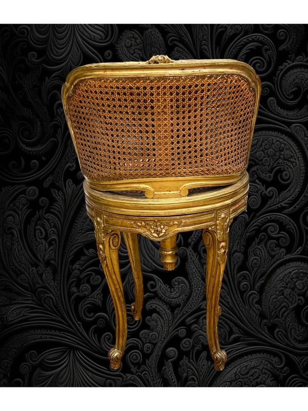 FAUTEUIL TOURNANT COURBÉ EN BOIS DORÉ ET CANNAGE DU XIXe DE STYLE LOUIS XV