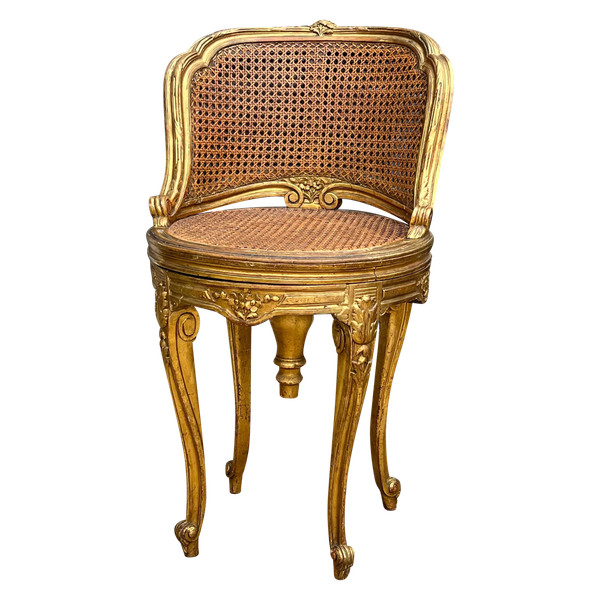 FAUTEUIL TOURNANT COURBÉ EN BOIS DORÉ ET CANNAGE DU XIXe DE STYLE LOUIS XV
