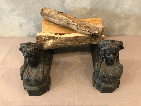 Pair of old cast iron andirons from the 19th century