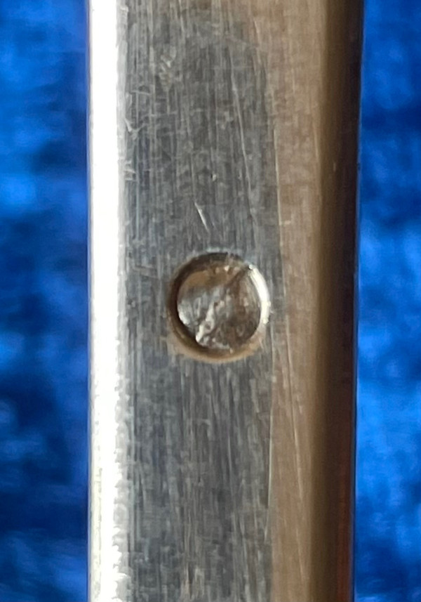 Solid silver shaker.