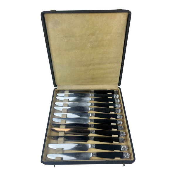 12 Table knives ebony handle silver ferrule