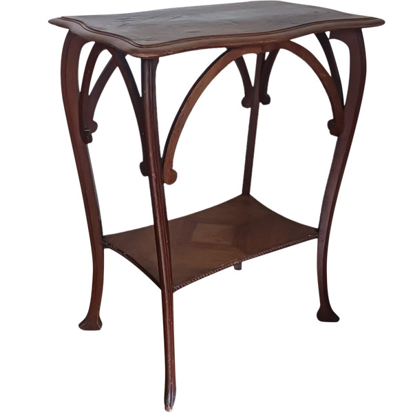 Art Nouveau work - walnut saddle table with spacer - circa 1900