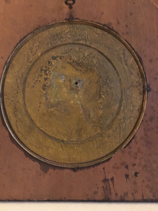 Pair of chased and gilded copper medallions, signed P. Faraoni (1869)