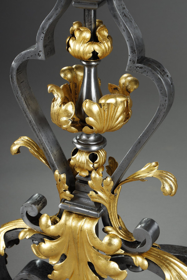 VERY LARGE PAIR OF WROUGHT IRON MANTELPIECES WITH FOLIAGE, MASK AND SCROLL MOTIFS