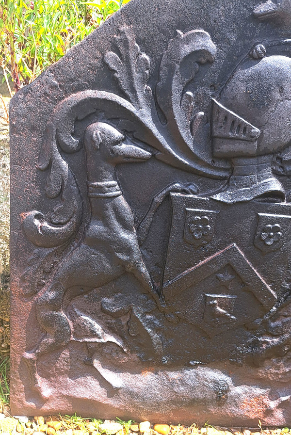 Cast iron fireback with canted sides framed by greyhounds 18th century