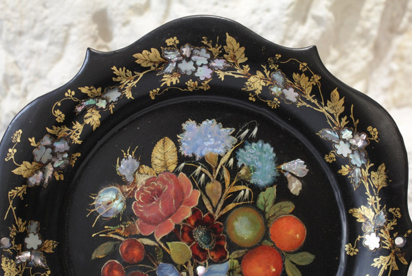 Rounded platter in painted black pressed material with mother-of-pearl inlay late 19th century