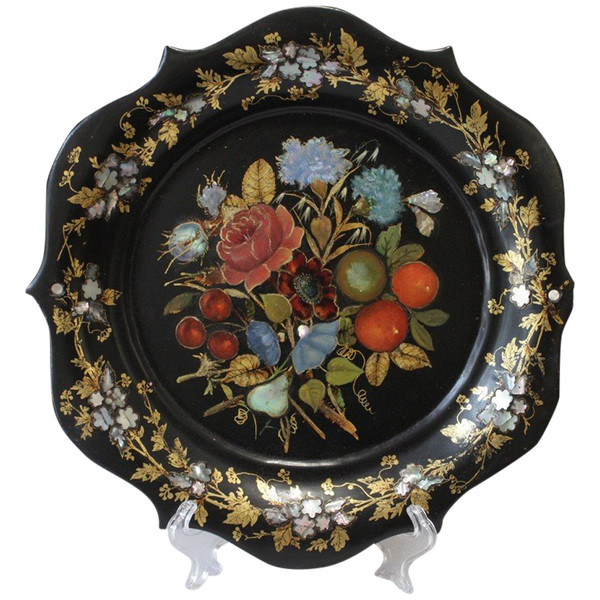 Rounded platter in painted black pressed material with mother-of-pearl inlay late 19th century