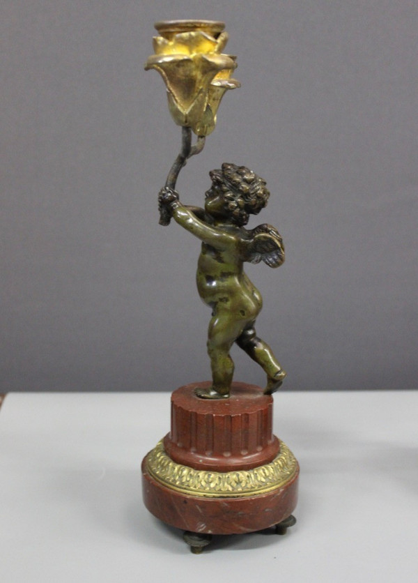 Borne Clock Surmounted by a Putti About 1880