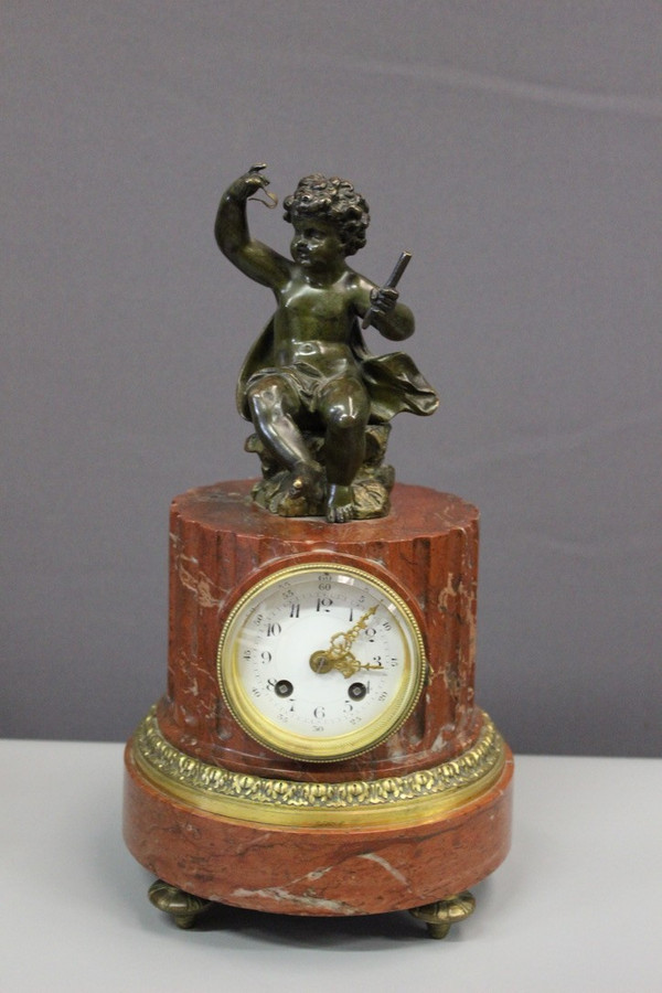 Borne Clock Surmounted by a Putti About 1880