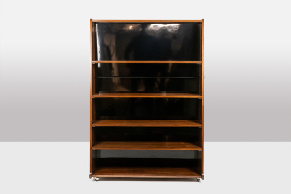 Libreria bifacciale con rotelle in palissandro. Circa 1960. LS58761008H