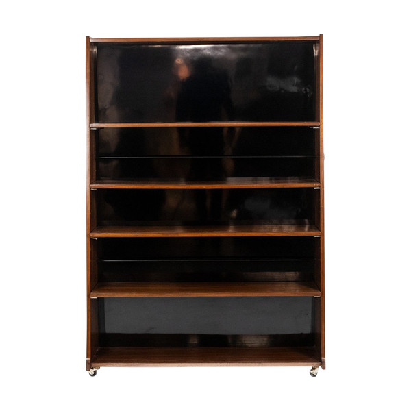 Libreria bifacciale con rotelle in palissandro. Circa 1960. LS58761008H