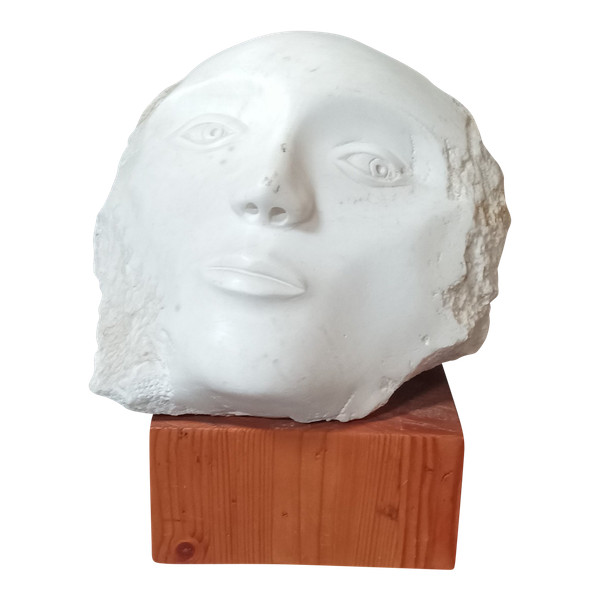 Face bust stone sculpture