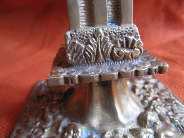 Pair of bronze candlesticks decorated with cherubs 19th century