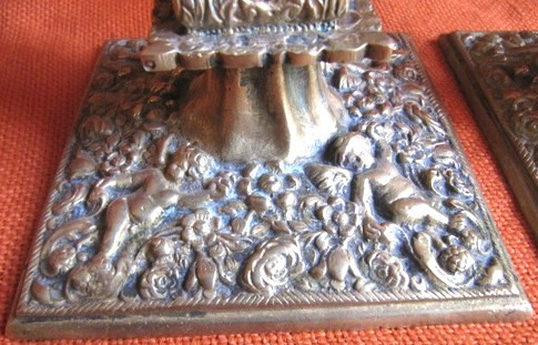 Pair of bronze candlesticks decorated with cherubs 19th century